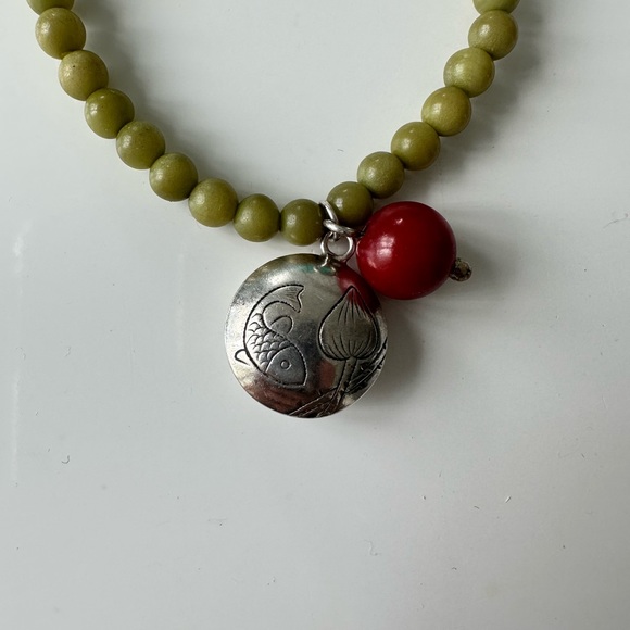 Green bracelet with silver fish embellished bracelet - Picture 2 of 3